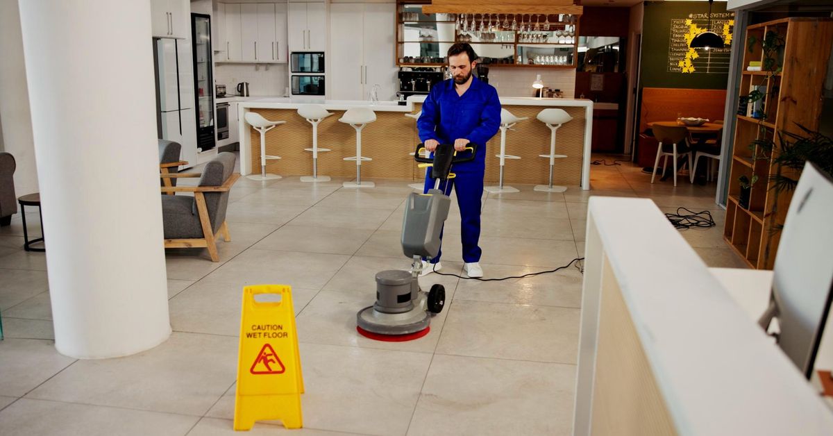 Deep cleaning a floor with a rotary polishing machine in Birmingham