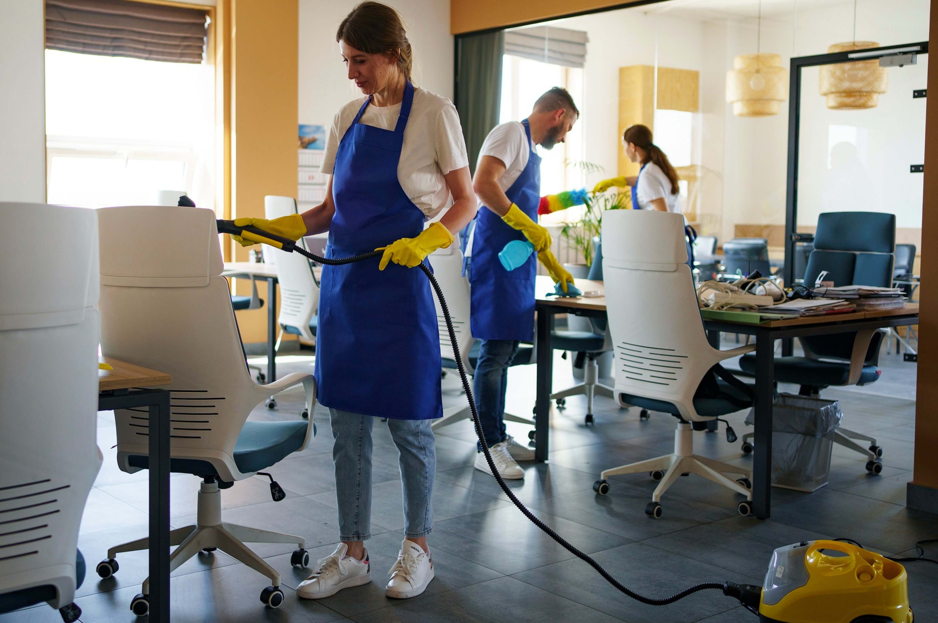 Professional deep clean team steam cleaning office furniture in Birmingham