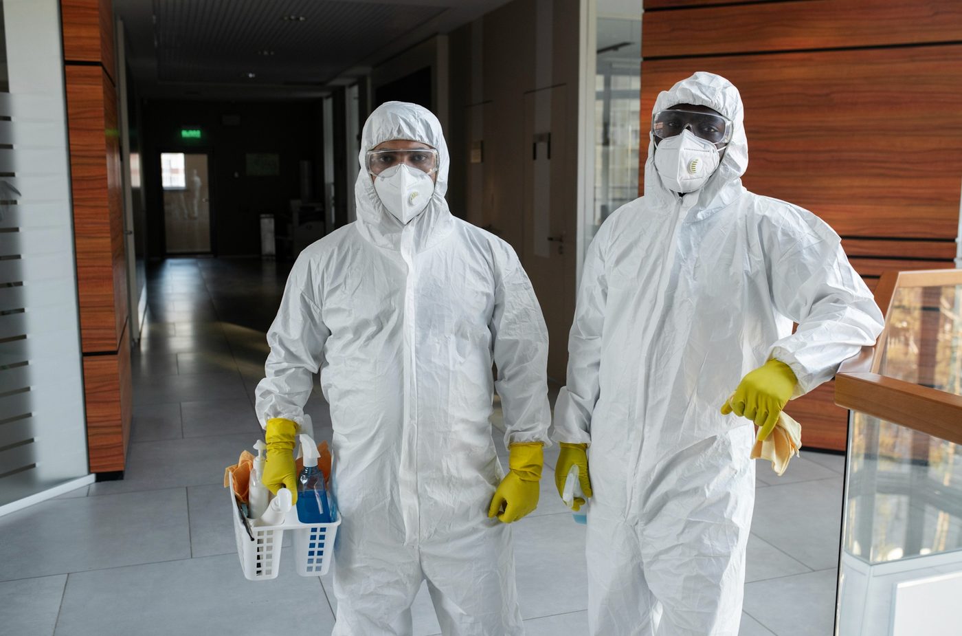 Cleaners in protective equipment carrying out specialist sanitising and infection control in Birmingham